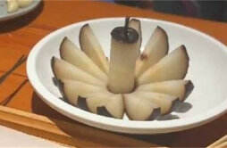 哈尔滨冻梨碰到南方游客变精致了 哈尔滨的冻梨怎么吃
